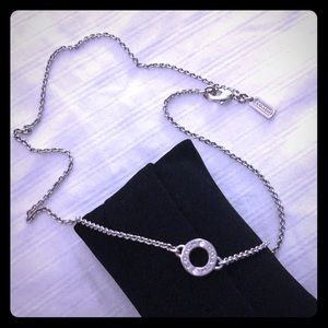 Silver COACH necklace with circle pendant